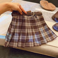 Girls plaid pleated A-line skirt in cotton blend fabric on a hanger