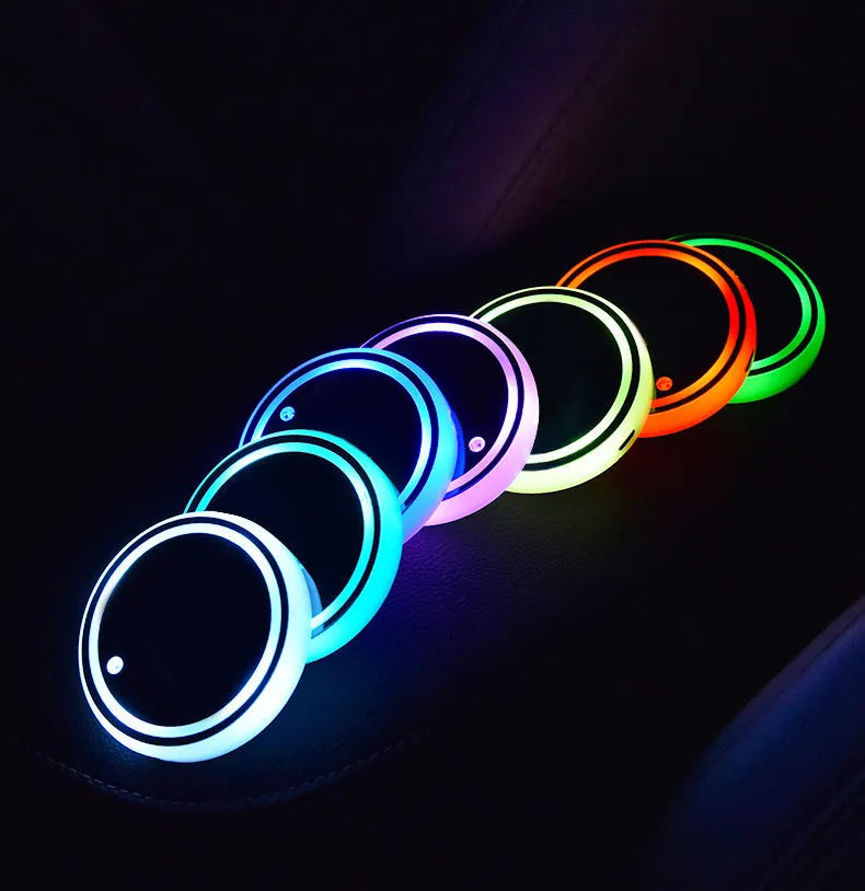 Colourful LED light-up coaster for car cup holder with seven colour options and USB cable.