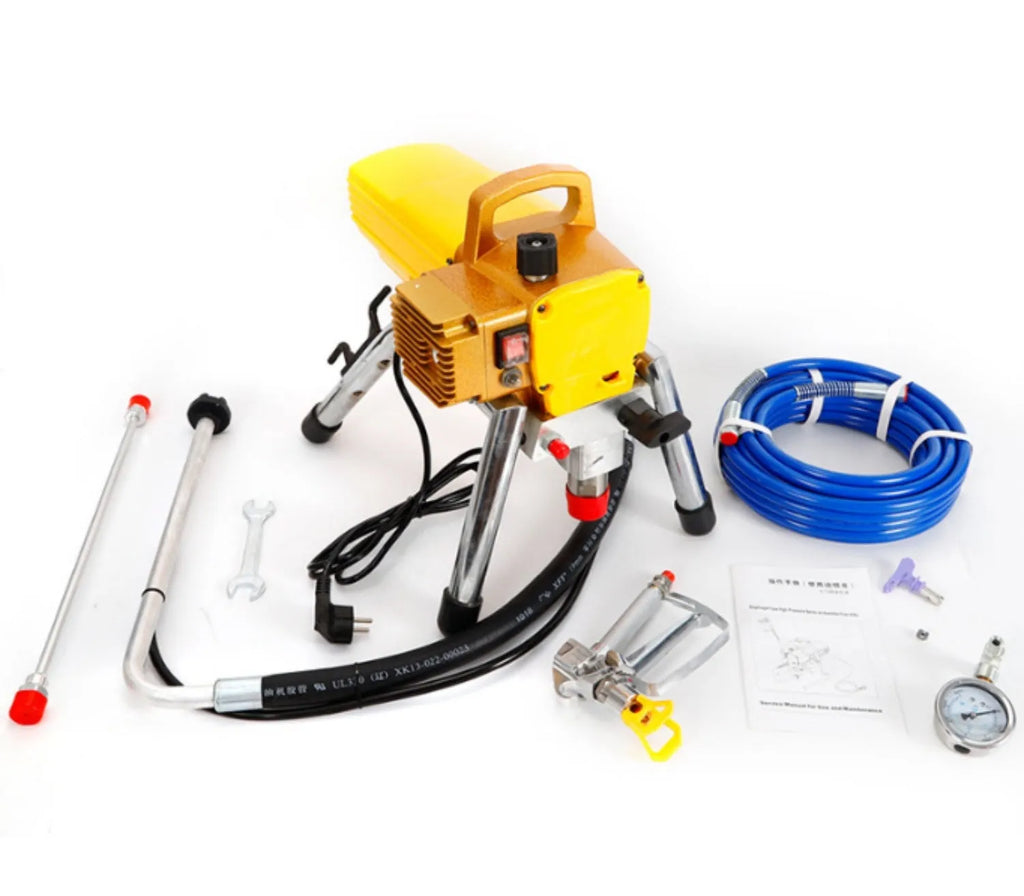 Blue portable electric airless spraying machine with spray gun, hose, and accessories on a workbench.