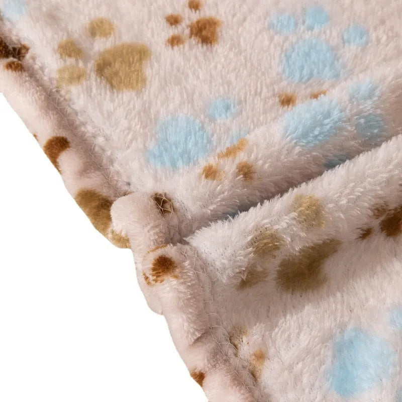 Blue cartoon dog pattern on a double-sided thickened flannel pet blanket laid flat.