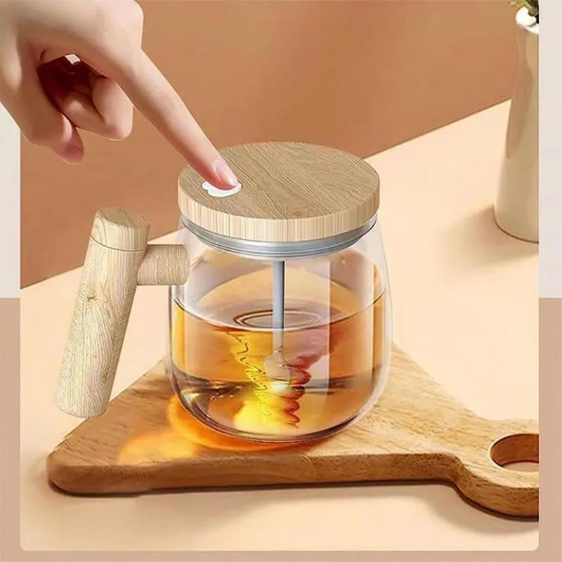 Clear borosilicate glass self-stirring coffee mug with electric base, 400ml capacity.