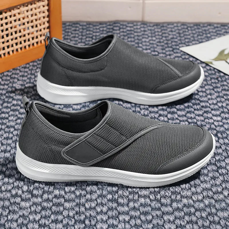 Round-toe mountaineering walking shoes with mesh upper and Velcro strap in multiple colours.