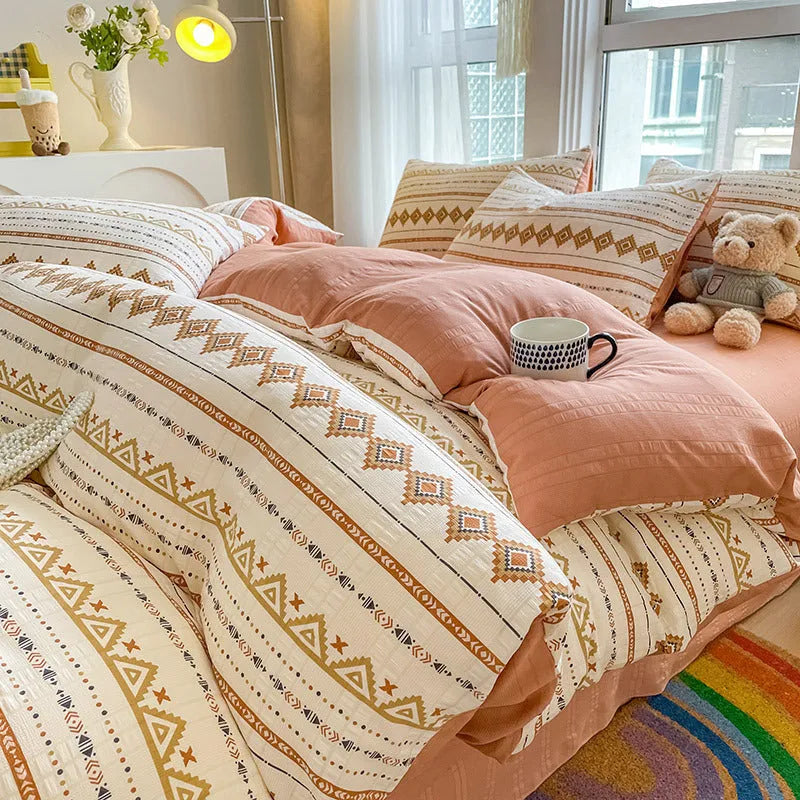 Aerobic jacquard cloud yarn four-piece bedding set with quilt cover, sheet, and pillowcases in a soft pattern.