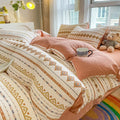 Aerobic jacquard cloud yarn four-piece bedding set with quilt cover, sheet, and pillowcases in a soft pattern.
