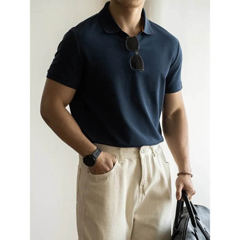 American-style short-sleeved polo shirt in blue on hanger showing regular fit and cotton blend fabric.