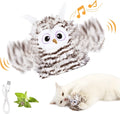 Grey owl-shaped automatic cat toy with flapping wings on flat surface