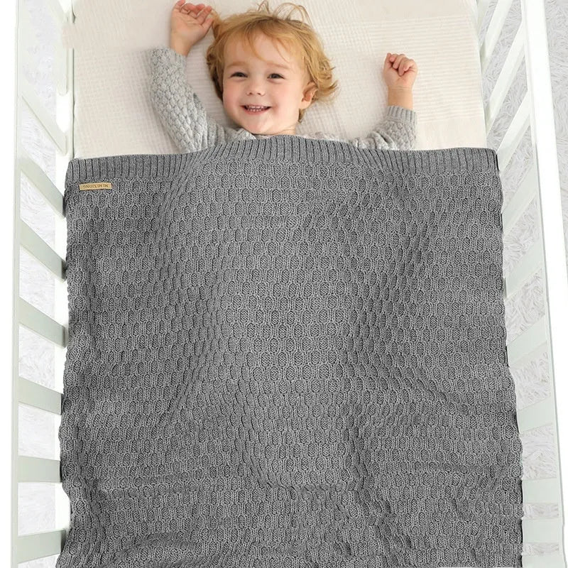 Solid colour infant hug blanket with textured lines in beige khaki, size 70 by 90 cm.